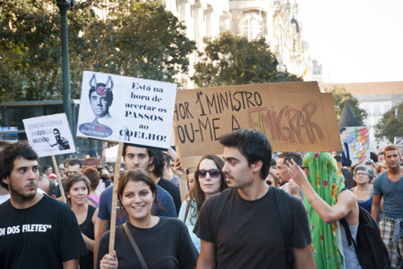 PORTO, PORTUGAL - SEPTEMBER 15: People protesting against government spending cuts and tax rises in Aliados square, Porto on September 15, 2012.のeditorial素材