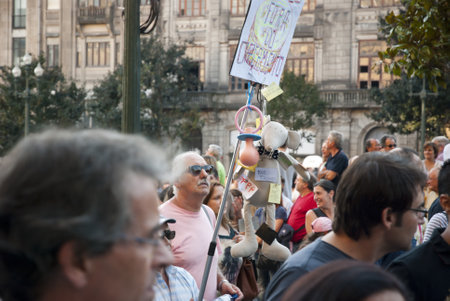 PORTO, PORTUGAL - SEPTEMBER 15: People protesting against government spending cuts and tax rises in Aliados square, Porto on September 15, 2012.のeditorial素材
