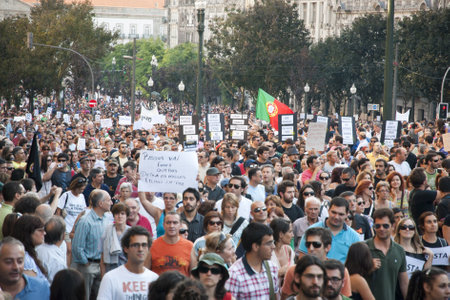 PORTO, PORTUGAL - SEPTEMBER 15: People protesting against government spending cuts and tax rises in Aliados square, Porto on September 15, 2012.のeditorial素材