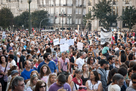PORTO, PORTUGAL - SEPTEMBER 15: People protesting against government spending cuts and tax rises in Aliados square, Porto on September 15, 2012.のeditorial素材
