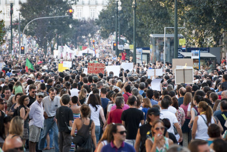 PORTO, PORTUGAL - SEPTEMBER 15: People protesting against government spending cuts and tax rises in Aliados square, Porto on September 15, 2012.のeditorial素材