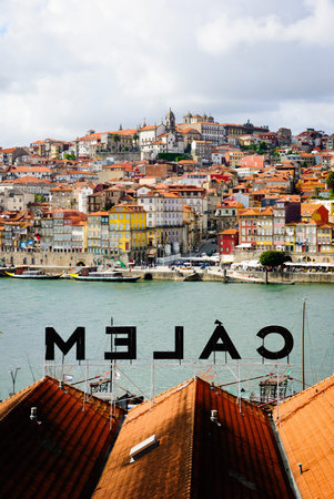 PORTO, PORTUGAL - APRIL 21, 2012 - View towards Porto over the Calem wine cellar roof. Calem is one of recognizable Porto Wine companies.のeditorial素材