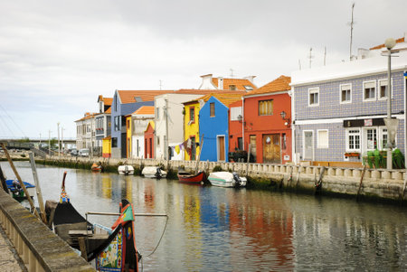 Typical boats in water canals in Aveiro, Portugalのeditorial素材
