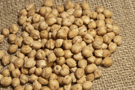 Chickpeas on natural brown fabricの写真素材