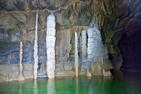 Cave with stalagmites and stalactites and underground riverの写真素材