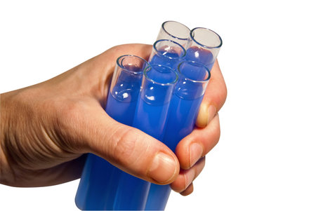 Laboratory samples in epruvetes holding with hand isolated on white background