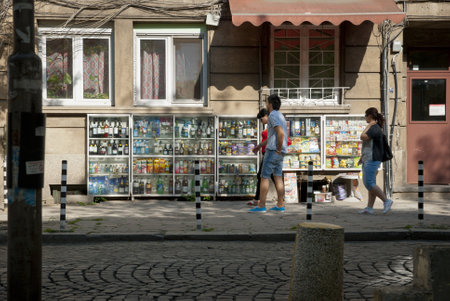 SOFIA, BULGARIA - APRIL 30: People buying groceries in small street shop through the window in Sofia, Bulgaria, on April 30, 2013.のeditorial素材