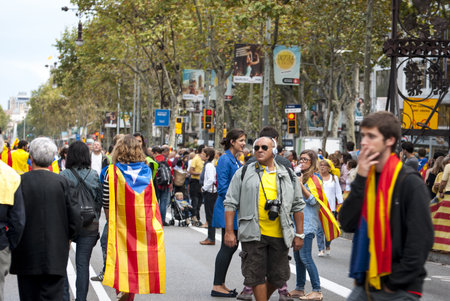 BARCELONA, SPAIN - SEPTEMBER 11: People joining the human chain "Catalan Way" crossing all Catalonia, silent demonstration for independent Catalonia in Barcelona, Spain on September 11, 2013のeditorial素材