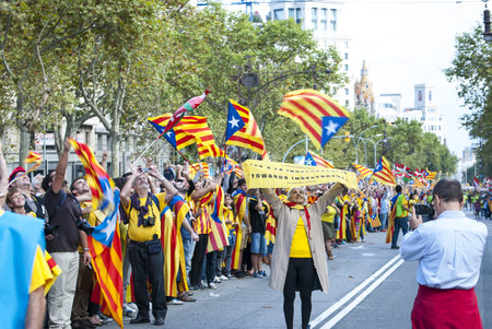 BARCELONA, SPAIN - SEPTEMBER 11: People joining the human chain "Catalan Way" crossing all Catalonia, silent demonstration for independent Catalonia in Barcelona, Spain on September 11, 2013のeditorial素材