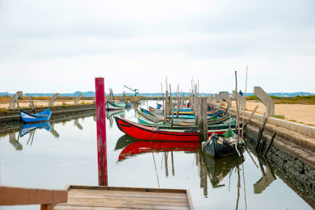 Old boats in water canal of Rio Aveiro, Portugalのeditorial素材