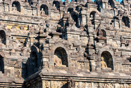Details with buddhas on the side of borobudor temple, Yogyakarta, Indonesia