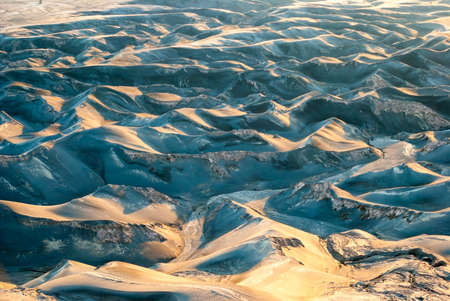 Ash drunes background at mount Bromo plateau, Indonesiaの写真素材