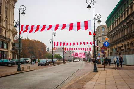 WARSAW, POLAND - NOVEMBER 10: Street in Warsaw decorated with polish flags before Polish national day on November 10, 2014のeditorial素材