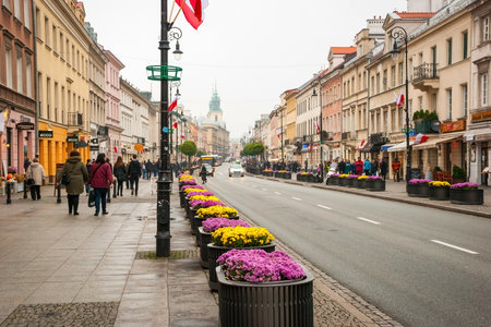 WARSAW, POLAND - NOVEMBER 10: People walking on the street in Warsaw, Poland on November 10, 2014のeditorial素材