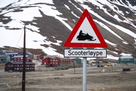 Snow mobile warning sign in Longyearbyen, Svalbard, Norwayの写真素材