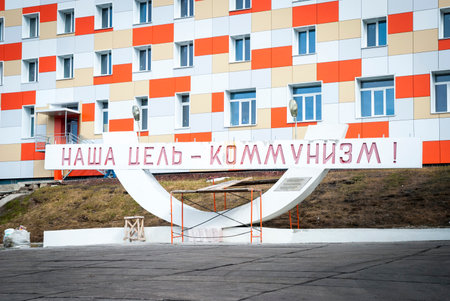Historic communistic statue saying "Our goal - communism" in Barentsburg, Svalbardのeditorial素材