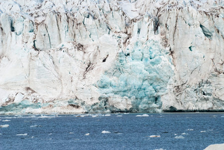 Icebergs in front of the glacier and mountains behind, Svalbard, Norwayの写真素材