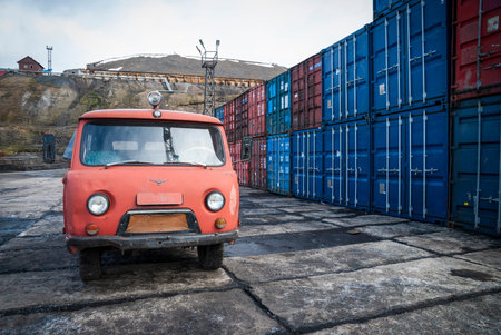 Old fashioned red van parked in Barentsburg port, Svalbardのeditorial素材