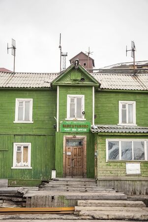 Old port sea office building in Barentsburg, russian settelement on Svalbard, Norwayの写真素材