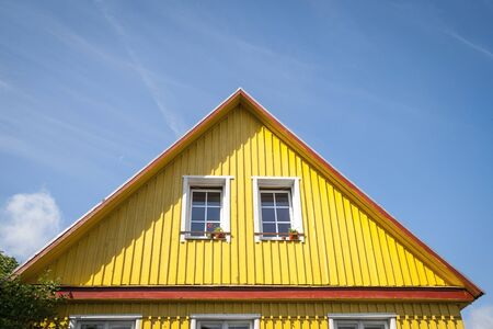 Typical lithuanian house by the road in villageの写真素材