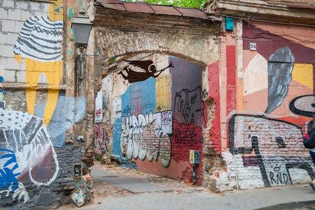 View on abandoned street with graffiti on walls in Vilnius, Lithuaniaのeditorial素材