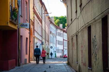 KAUNAS, LITHUANIA - NOVEMBER 16: Unrecognizable couple walking along the street in old town on November 16 in Kaunas, Lithuania.のeditorial素材