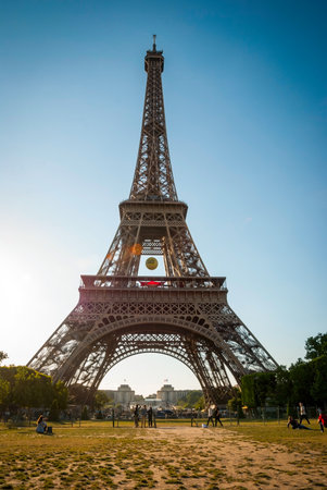 PARIS, FRANCE - JUNE 8: Eiffel tower with park around. Tower was designed by Gustave Eiffel and Stephen Sauvestre in 1889 and is one of main landmark of Paris. June 2015.のeditorial素材