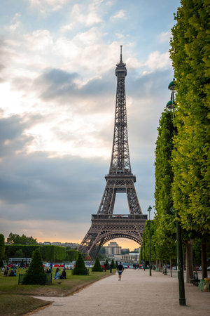 PARIS, FRANCE - JUNE 9: Eiffel tower with park around. Tower was designed by Gustave Eiffel and Stephen Sauvestre in 1889 and is one of main landmark of Paris. June 2015.のeditorial素材