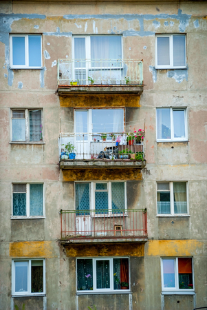 Worn-out block of flats with balconies in Latviaの写真素材
