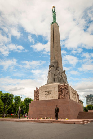 RIGA, LATVIA - JULY 30: Guards standing in front of Freedom monument in Riga. July 2015のeditorial素材