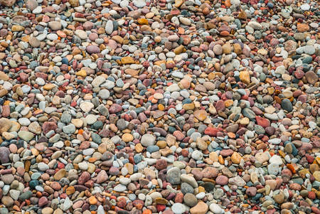 Small colorful stones on Liepaja beach in Latviaの写真素材