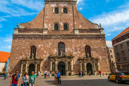 RIGA, LATVIA - AUGUST 8: People passing square in front of Saint James cathedral on sunny summe day. August 2015のeditorial素材