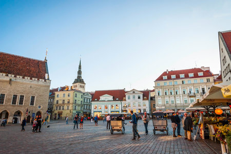 TALLINN, ESTONIA - AUGUST 17: Medieval market in front of Tallinn city hall on old town square in morning sun. August 2015のeditorial素材