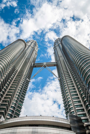 View on famous high-rise Petronas twin tower with bridge from below, Kuala Lumpur, Malaysiaのeditorial素材