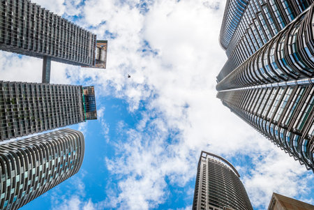 View on famous high-rise Petronas twin tower with bridge from below, Kuala Lumpur, Malaysiaのeditorial素材