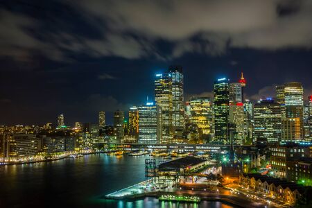 View on Sydney downtown at Circular quay with ferry terminal at nightの写真素材