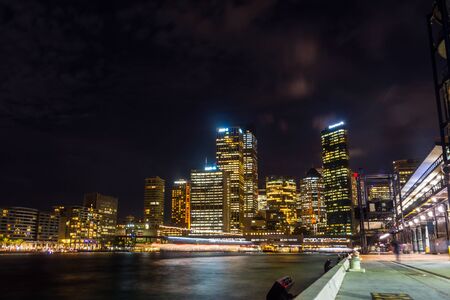 View on Sydney downtown at Circular quay with ferry terminal at nightの写真素材