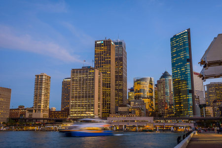 View on Sydney downtown at Circular quay with ferry terminal at nightのeditorial素材