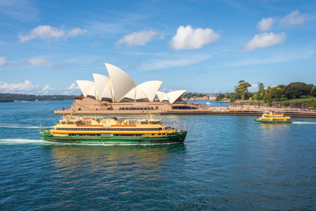 View on famous Syndey Opera House and ferries in daylightのeditorial素材