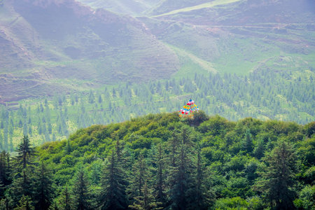 Green landscape and mountains surrounding Mati si temple Gansu Province China