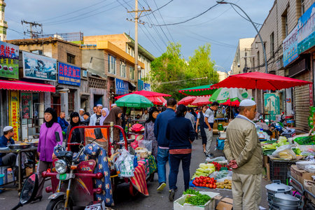 XINING CHINA - JUNE 22: People mostly Uyghur buying and selling stuff in the afternoon uyghur market in Xining capital of Qinghai on June 2016のeditorial素材