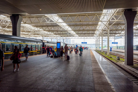 CHENGDU CHINA - JUNE 19: People boarding the train at the platform at Chengdu East train station June 2016のeditorial素材