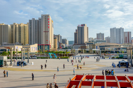 XINING CHINA - JUNE 22: View over Xining city and square in front of the train station with people passing by. June 2016のeditorial素材