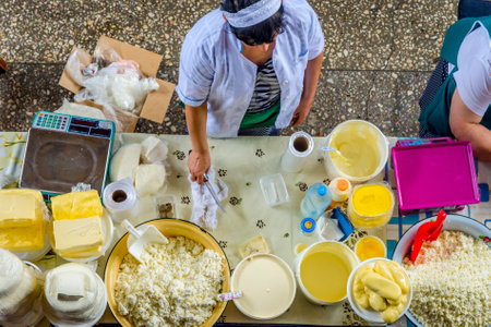 ALMATY, KAZAKHSTAN - JULY 15: Women selling home made dairy products, cheese, butter and cream at Green bazaar, view from above. July 2016のeditorial素材