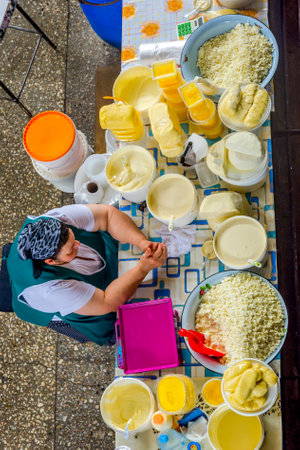 ALMATY, KAZAKHSTAN - JULY 15: Women selling home made dairy products, cheese, butter and cream at Green bazaar, view from above. July 2016のeditorial素材