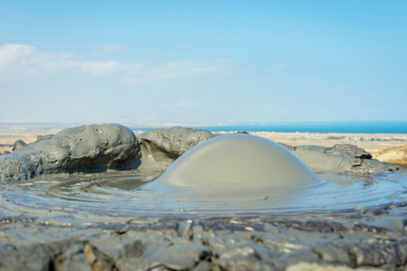 Mud volcano erupting mud bubble, Gobustan, Azerbaijanの写真素材