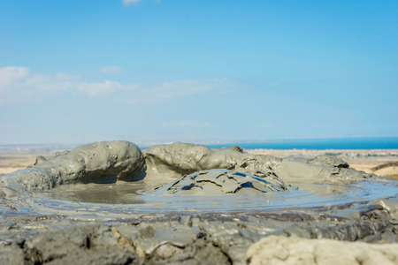 Mud volcano erupting mud bubble, Gobustan, Azerbaijanの写真素材