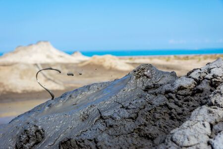Mud volcano erupting mud, Gobustan park, Azerbaijanの写真素材