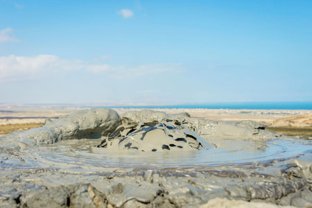 Mud volcano erupting mud bubble, Gobustan, Azerbaijan