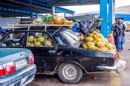BAKU, AZERBAIJAN - SEPTEMBER 24: Old Lada car loaded with ripe honey melons at whole sale market in Baku, Azerbaijan. September 2016.のeditorial素材